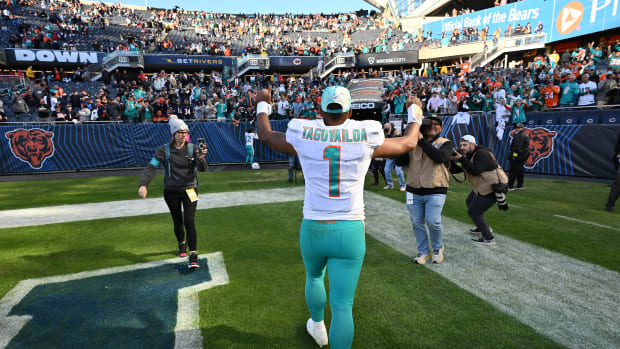 Nov 6, 2022; Chicago, Illinois, USA; Miami Dolphins quarterback Tua Tagovailoa (1) heads to the locker room after defeating the Chicago Bears 35-32 at Soldier Field. Mandatory Credit: Jamie Sabau-USA TODAY Sports